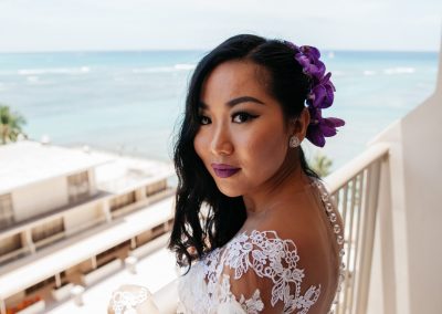 Nhu on a balcony next to the beach