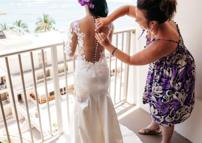 Nhu having her dress buttoned