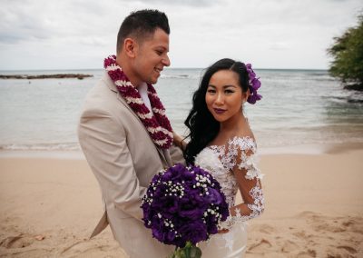 Nhu and her husband posing on the beach