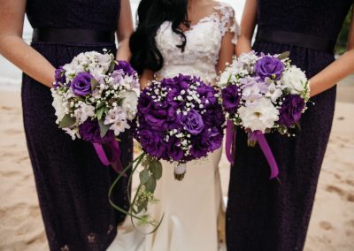 Nhu and her bridesmaids displaying their bouquets