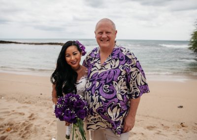 Nhu and Carl standing together on the beach