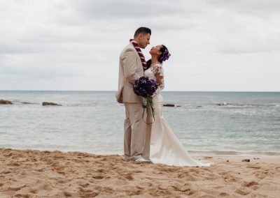 Nhu and her husband standing on the beach