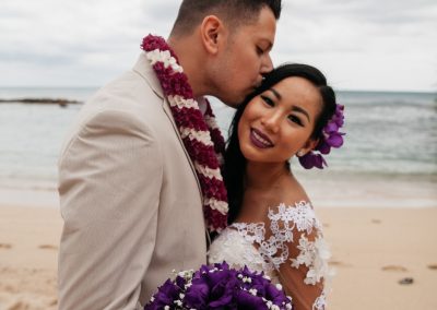 Nhu's husband kissing her head