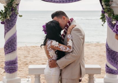 Nhu and her husband kissing at their wedding