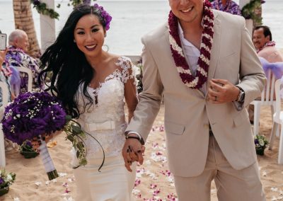 Nhu and her husband walking down the aisle