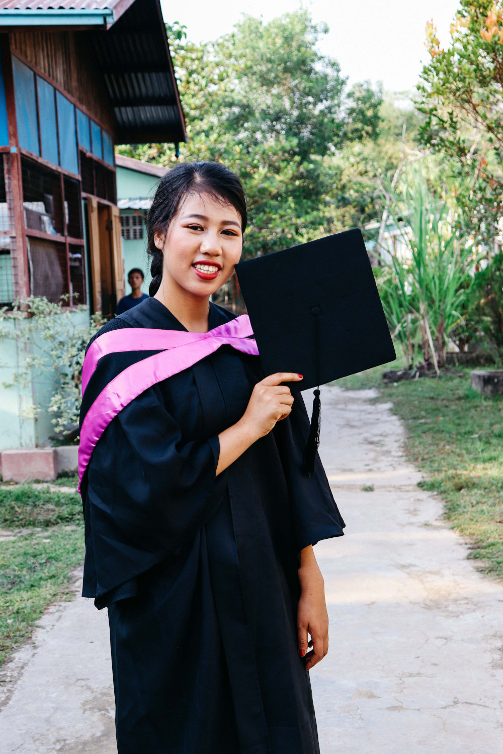 A Graduation holder her hat