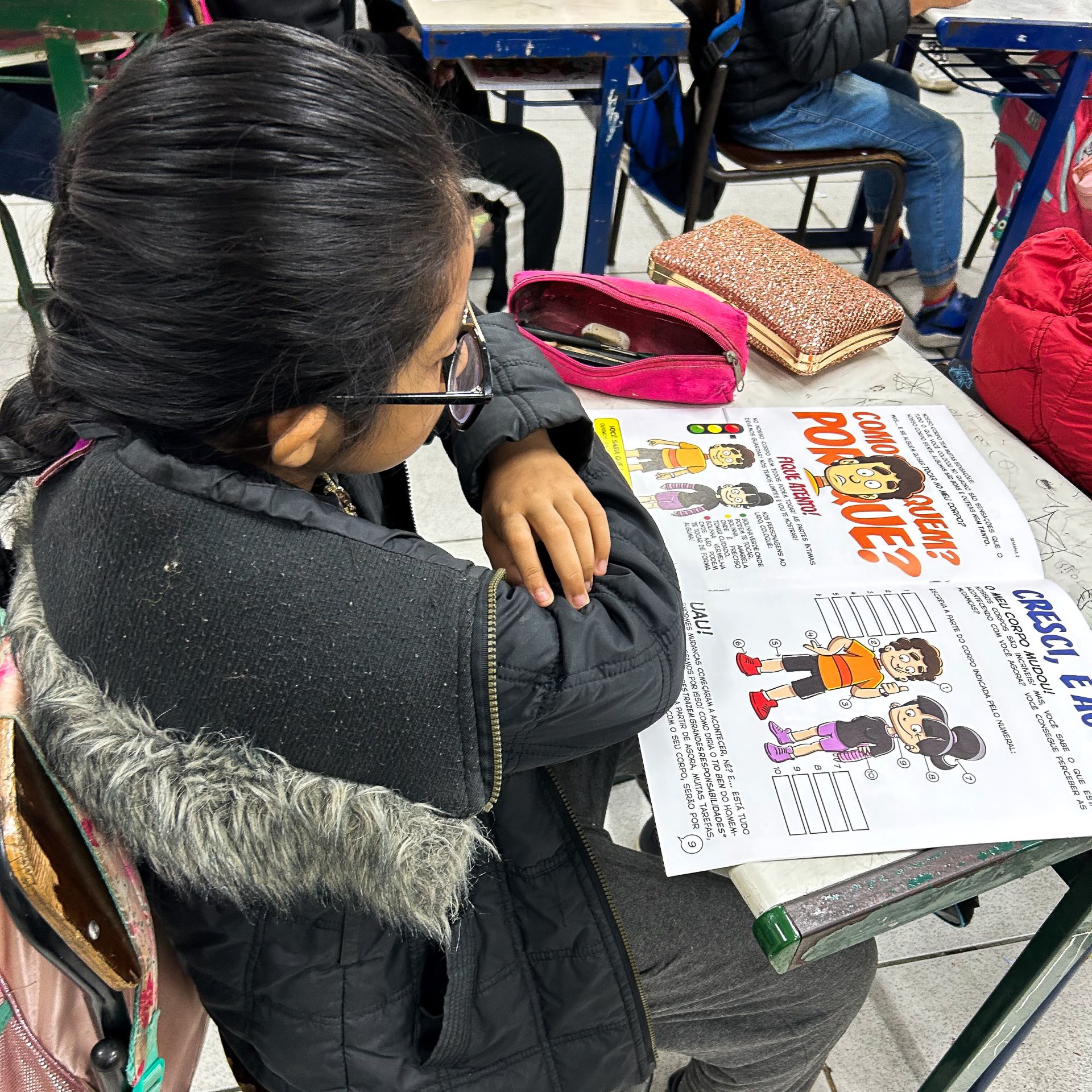 Girl holding a sign that says "Children should Never be sold"