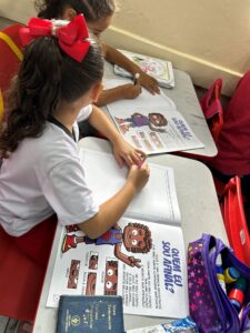 2 Girls studying the Trafficking Prevention comic book