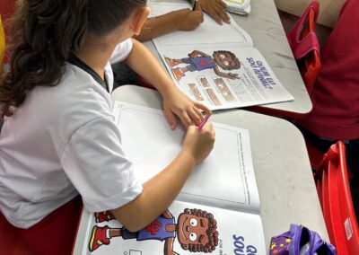 2 Girls studying the Trafficking Prevention comic book