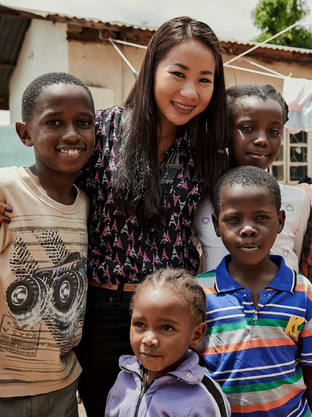 Nhu Standing with a group of children