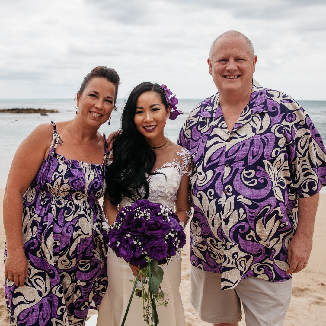 Nhu standing in her wedding dress with Carl and Laurie